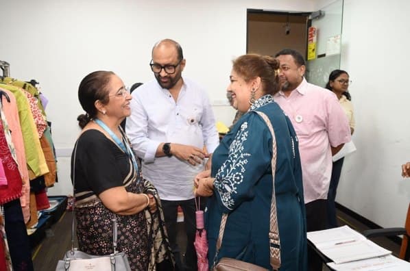 Summit participants in conversation during a networking break