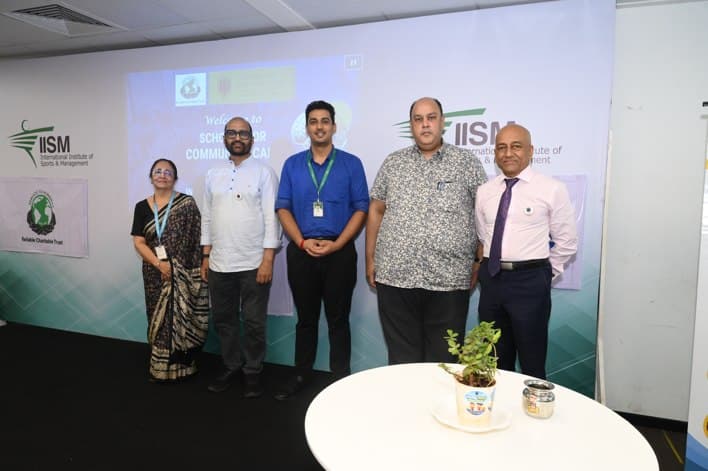 The IEC and Reliable Charitable Trust team on stage at the summit
